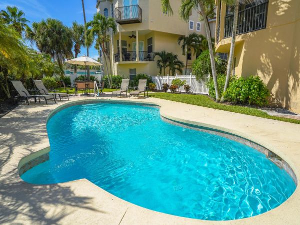Short Walk to Beach from this Four Bedroom Condo in Siesta Key