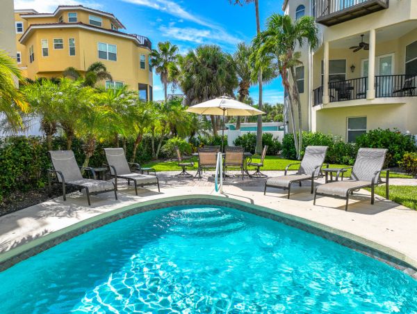 Short Walk to Beach from this Four Bedroom Condo in Siesta Key