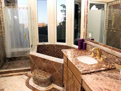 bathroom with tub and shower