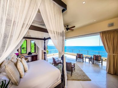 Wake in your Canopy Bed Looking Out Onto the Ocean.