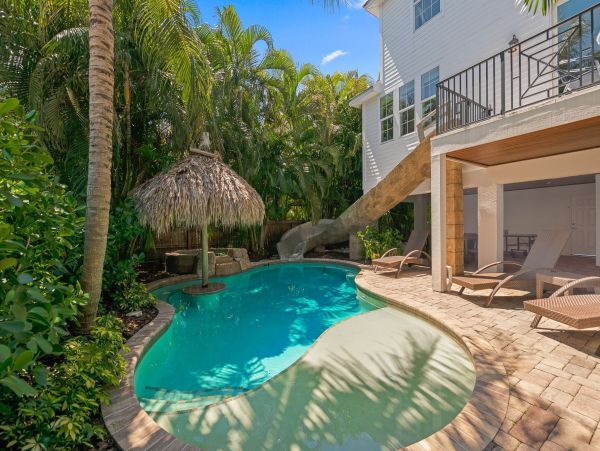 Luxury Holmes Beach Vacation Rental 6-Bedroom Anna Maria Island Home with Pool & Waterslide