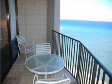 Ocean view balcony with table set