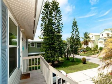 Holmes Beach Duplex with Separate Pools Sleeps 10