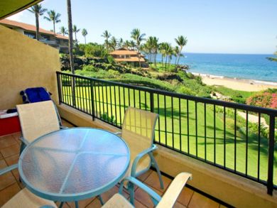Balcony with table set & beach view