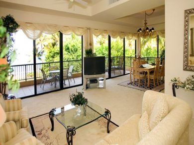Living area with TV & open to balcony