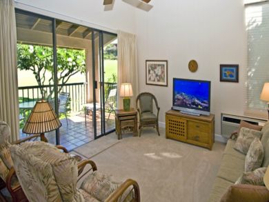 Living room with flat screen & open to balcony