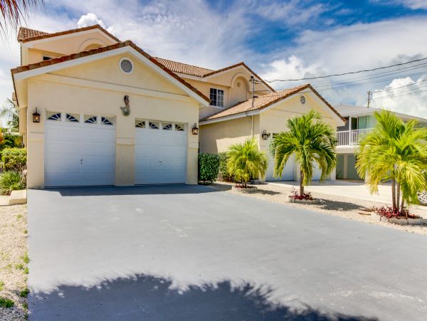 Key Colony Three Bedroom Family Home with Canal Front Porch