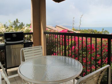 Balcony with outdoor dining area & gas grill