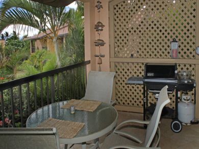 Table set & gas grill on balcony