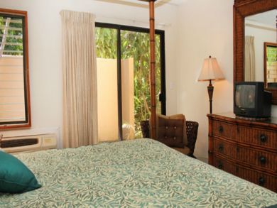 Bedroom with TV & open to patio