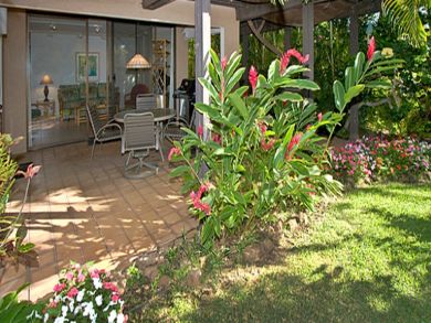 Private patio &  lush tropical landscaping