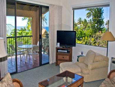 Living room with flat screen & open to balcony