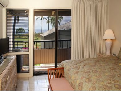 Bedroom with TV & open to balcony