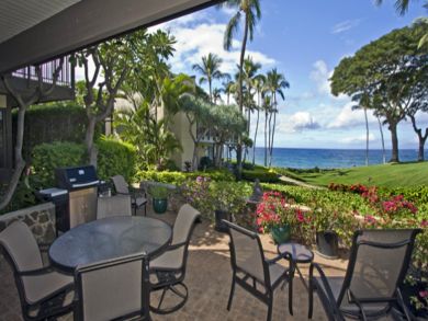 Ocean view patio with table set & BBQ grill