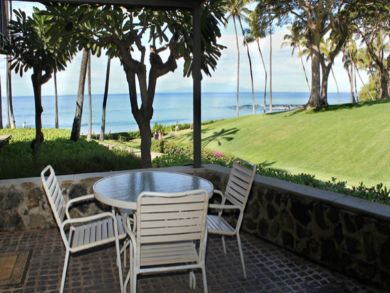 Patio with table set & ocean view