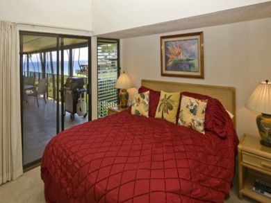 Bedroom with king bed open to balcony