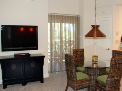 Entertainment center & dining area seats four