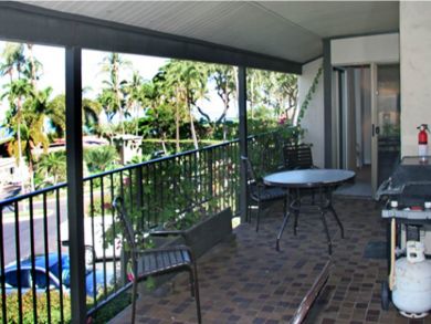 Balcony with table set & gas grill