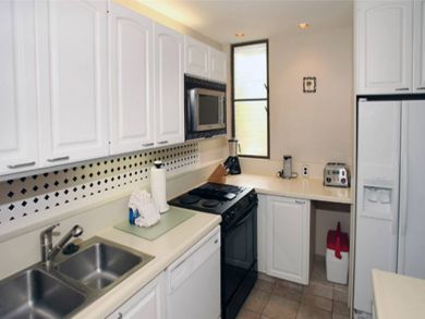 Kitchen with poen serving bar seats two