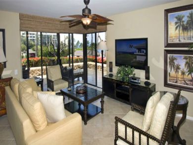 Living room with large wall-mount flat screen cable television