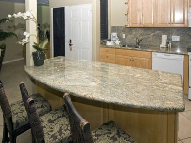 Kitchen with breakfast bar seats three