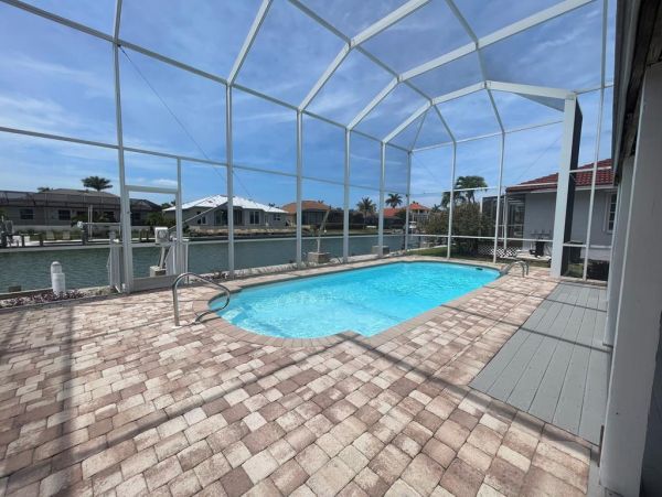 Enjoy Marco Island Living Cozy Waterfront Home with Screened-in Pool