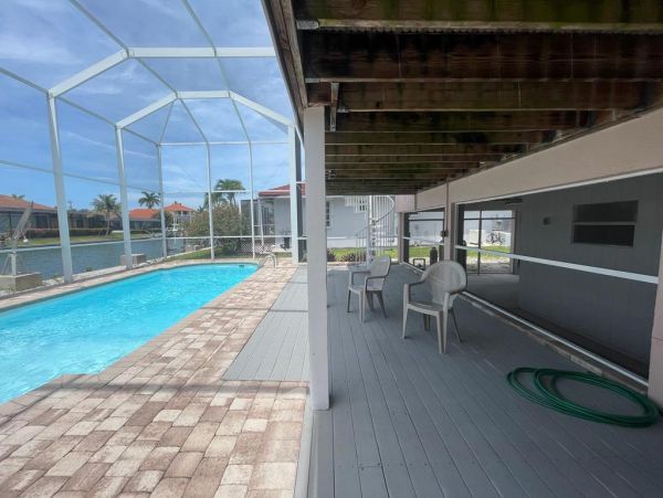 Enjoy Marco Island Living Cozy Waterfront Home with Screened-in Pool