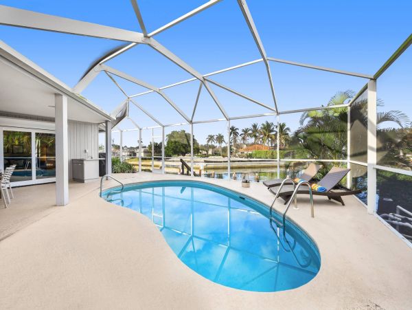 Marco Island Canal Front 3 Bedrooms Home with Caged Pool
