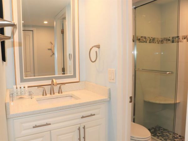 Walk to South Village from this bayside condo