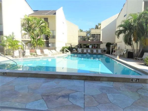 Walk to South Village from this bayside condo