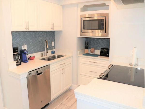 Walk to South Village from this bayside condo