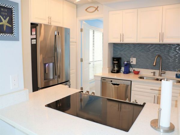 Walk to South Village from this bayside condo