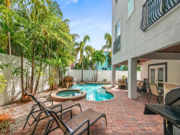 Island Oasis with Pool, Hut Tub, and Rooftop Deck, Steps from Manatee Beach