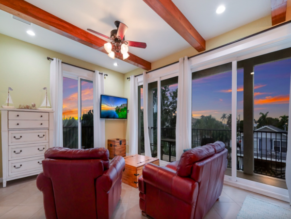 Island Oasis with Pool, Hut Tub, and Rooftop Deck, Steps from Manatee Beach