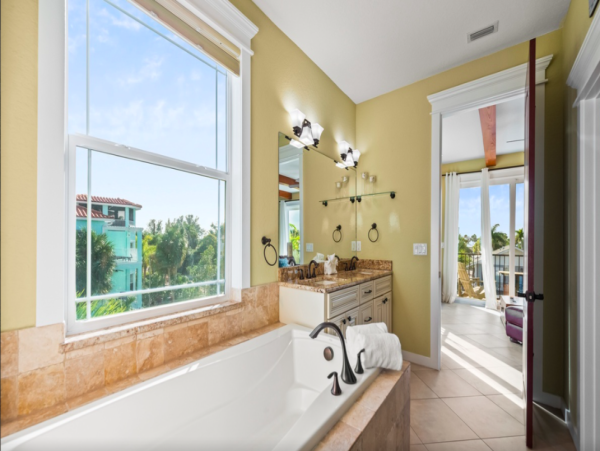Island Oasis with Pool, Hut Tub, and Rooftop Deck, Steps from Manatee Beach