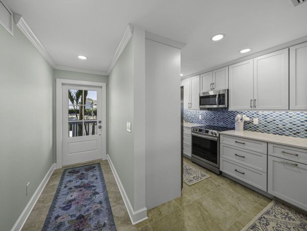 Coastal Elegance: Renovated 2-Bedroom Condo Right On the Beach