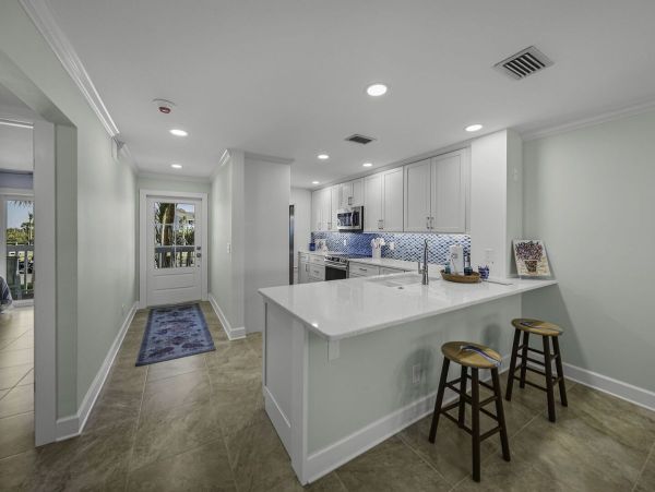 Coastal Elegance: Renovated 2-Bedroom Condo Right On the Beach