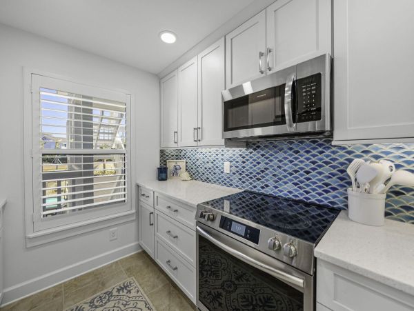 Coastal Elegance: Renovated 2-Bedroom Condo Right On the Beach