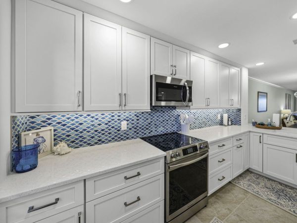 Coastal Elegance: Renovated 2-Bedroom Condo Right On the Beach