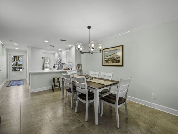 Coastal Elegance: Renovated 2-Bedroom Condo Right On the Beach