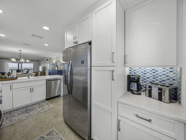 Coastal Elegance: Renovated 2-Bedroom Condo Right On the Beach