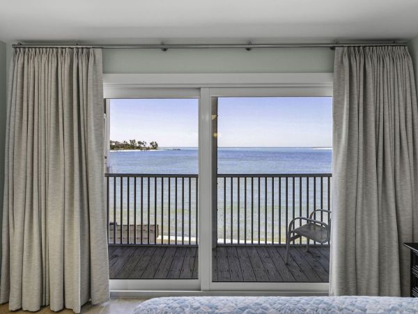 Coastal Elegance: Renovated 2-Bedroom Condo Right On the Beach