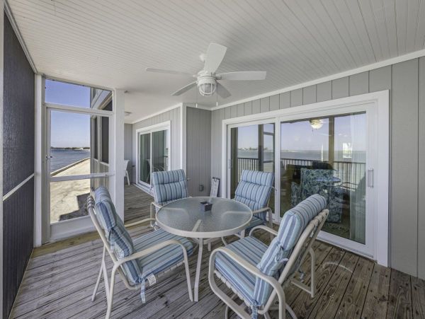 Coastal Elegance: Renovated 2-Bedroom Condo Right On the Beach
