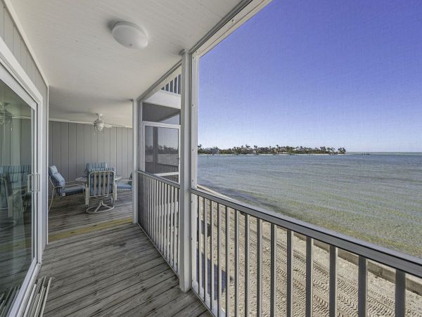 Coastal Elegance: Renovated 2-Bedroom Condo Right On the Beach