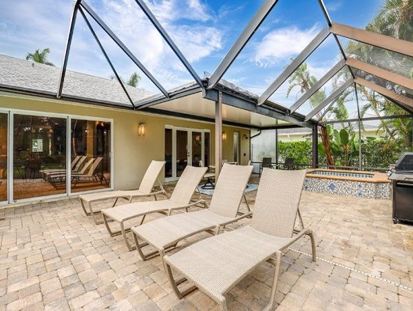 Naples Walk to Beach 4 Bedroom Rental Home with Caged Pool