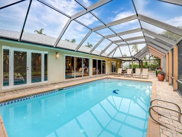 Naples Walk to Beach 4 Bedroom Rental Home with Caged Pool