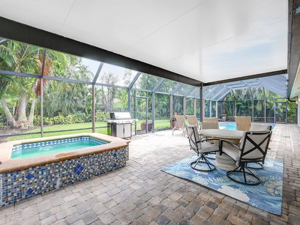 Naples Walk to Beach 4 Bedroom Rental Home with Caged Pool