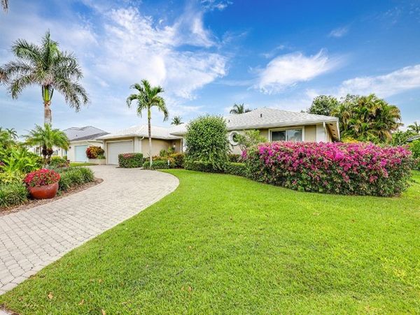 Naples Walk to Beach 4 Bedroom Rental Home with Caged Pool
