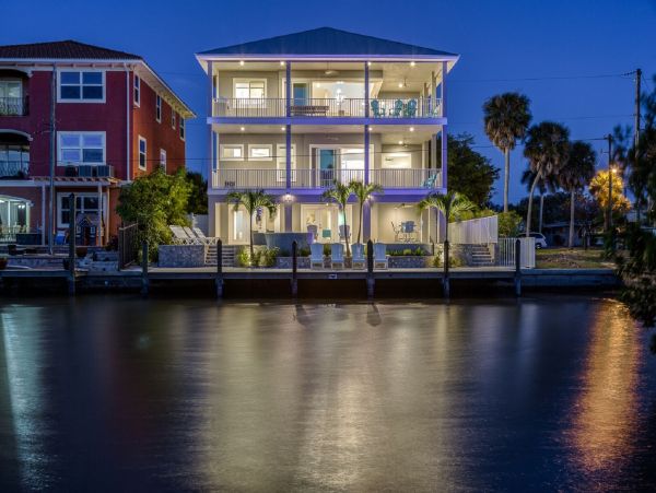 Fort Myers Beach Luxury Vacation Rental Florida Gulf Coast Canal front Home with Pool & Dock