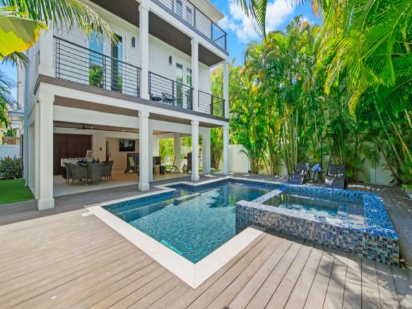 Luxurious 7 Bedroom Home Featuring a Tropical Outdoor Oasis
